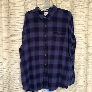 Columbia button-down flannel shirts are worn in casual outings & or outdoors
